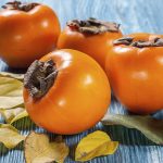 Persimmons on table